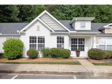Charming home with white siding, well-manicured landscaping, and a welcoming entrance at 409 Lexie Ln, Rock Hill, SC 29732