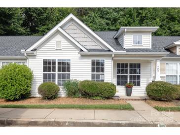 Charming home featuring a light exterior, well-maintained landscaping, and bright windows at 409 Lexie Ln, Rock Hill, SC 29732