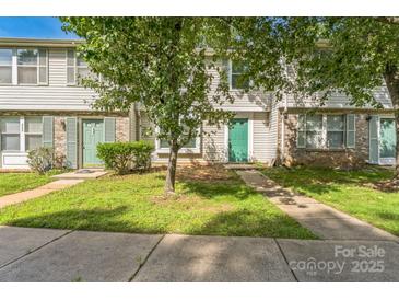 Townhouses with trees in front on a sunny day at 5226 Fair Wind Ln, Charlotte, NC 28212