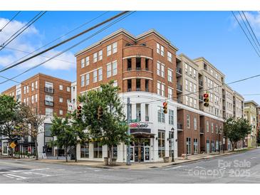 Corner building featuring classic brickwork, modern storefronts, and pedestrian-friendly streetscape at 1315 East Blvd, Charlotte, NC 28203