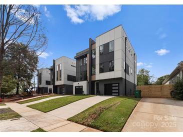 Contemporary townhouse exteriors feature modern design, gray and white paneling, and well-manicured lawns at 213 Keswick Ave, Charlotte, NC 28206