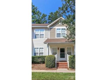 Charming two-story townhouse with well-maintained landscaping and a welcoming front entrance at 8350 Brickle Ln, Huntersville, NC 28078