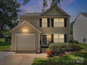Charming two-story home with neutral siding, black shutters, an attached garage, and a well-maintained lawn at 1252 Winding Path Rd, Lake Wylie, SC 29710