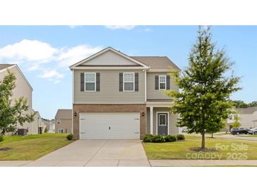 Two-story home featuring a gray facade, a two-car garage, and a well-maintained front lawn at 331 Gaines Rd, Clover, SC 29710