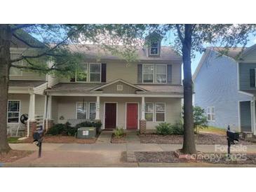 Charming two-story townhome with inviting front porch and well-maintained landscaping at 12450 Stone Garden Dr, Huntersville, NC 28078