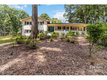 Charming two-story home with a covered front porch and beautiful landscaping at 1505 Clarendon Pl, Rock Hill, SC 29732