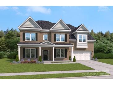 Beautiful two-story brick home with covered front porch and well-manicured lawn at 204 Coronado Ave, Matthews, NC 28104