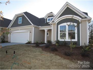 Charming home featuring a two-car garage and meticulously maintained front yard at 440 Shallowford Dr, Rock Hill, SC 29732