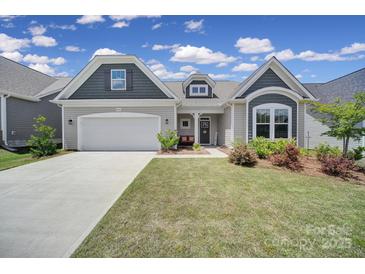 Charming one-story home with a well-manicured lawn, inviting entrance, and attached two car garage at 440 Shallowford Dr, Rock Hill, SC 29732