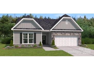 Charming single-Gathering home boasting stone accents, a well-manicured lawn, and an attached two-car garage at 905 Exeter Dr, Sherrills Ford, NC 28673