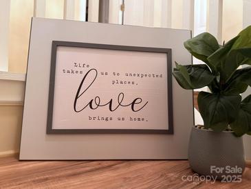 A decorative sign reads, 