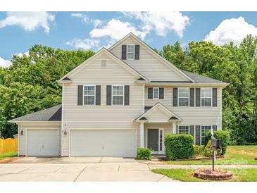 Beautiful two-story home with well-manicured lawn and landscaping at 3043 Streamlet Way, Monroe, NC 28110