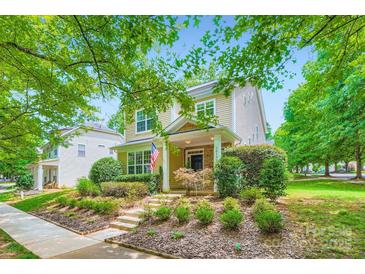 Charming two-story home with landscaped yard, stone accents and an inviting front porch at 10132 Caldwell Depot Rd, Cornelius, NC 28031