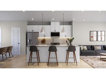 Modern kitchen with white cabinets, stainless steel appliances, and a large island at 4059 Bass River Pkwy, Charlotte, NC 28217