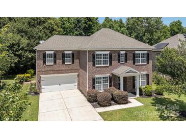 Beautiful brick home with a two-car garage and a manicured front lawn at 704 Millstream Dr, Rock Hill, SC 29732