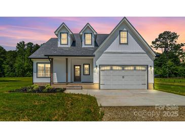 Charming two-story home featuring a two-car garage and well-maintained front lawn at 1010 Oneil Dr, Monroe, NC 28112