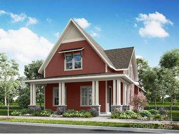 Charming home featuring a cozy front porch with stylish column supports and professionally landscaped front yard at 645 Hops Aly, Fort Mill, SC 29715
