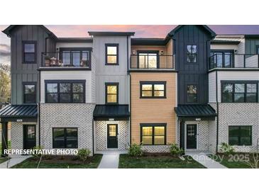 Charming townhome featuring modern design, brick accents, and a cozy balcony in a well-maintained neighborhood at 732 Falling Oak Aly # 22, Huntersville, NC 28078