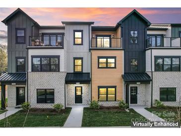Modern townhome complex with a mix of brick and siding exteriors at 732 Falling Oak Aly # 22, Huntersville, NC 28078