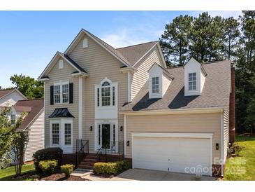 Charming two-story home with neutral siding, black shutters, and a well-maintained front yard at 4519 Rock Stream Dr, Charlotte, NC 28269