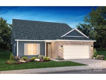 Charming single-story home boasts brick and siding exterior, with a well-manicured lawn and an attached two-car garage at 5640 Caneel Ln # 1011, Denver, NC 28037