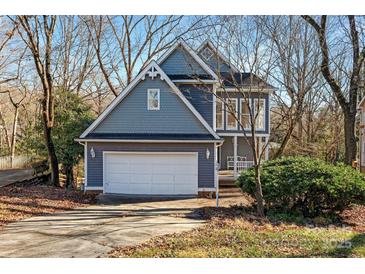 Charming two-story home with a two-car garage and covered front porch in a neighborhood setting at 6017 Millbury Ct, Charlotte, NC 28211