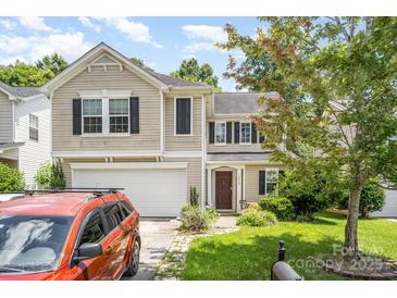 Charming two-story home with a well-maintained front yard, garage, and inviting entrance at 4312 Mary Point Rd, Monroe, NC 28110