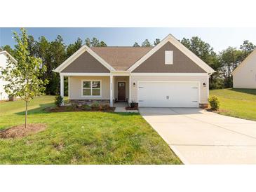 Charming single-Gathering home with neutral siding, well-manicured lawn, and a two-car garage at 5208 Admirals Lndg, Lancaster, SC 29720