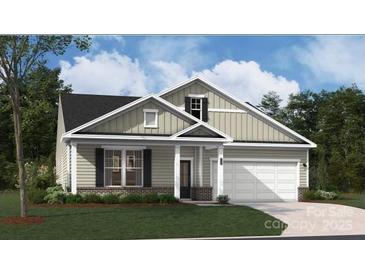 Charming one-story home with a gray exterior, a two-car garage, and a beautifully landscaped front yard at 916 Exeter Dr, Sherrills Ford, NC 28673