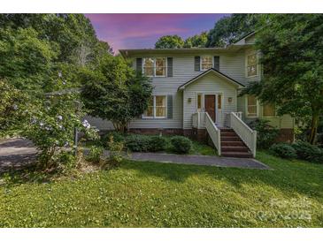 Charming two-story home features lush landscaping, a welcoming entrance, and a serene, tree-lined setting at 204 S Deerfield Cir, Salisbury, NC 28147