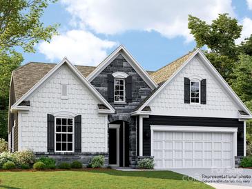 Charming new construction home showcasing a stylish stone and white facade with a two-car garage and manicured lawn at 6346 Fairfax Ct, Maiden, NC 28650
