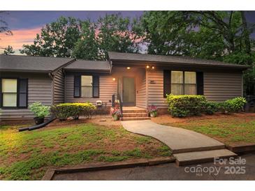 Charming single-story home features mature trees, and a cozy entrance with well-manicured landscaping at 407 Sweetgum Dr # B, Fort Mill, SC 29715