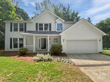 Charming two-story home with a well-maintained lawn and attached two-car garage at 424 Mallard Dr, Pineville, NC 28134