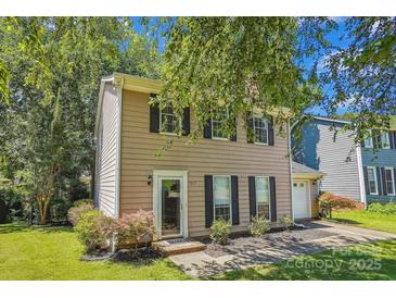 Charming home featuring a well-maintained lawn and a cozy, traditional design at 7217 Rena Mae Ln, Charlotte, NC 28227