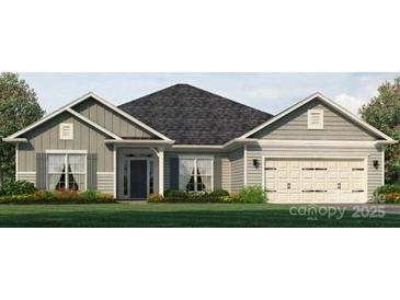 Charming one-story home featuring a two-car garage and manicured landscaping for a welcoming curb appeal at 1445 Mocksville Hwy # 26, Statesville, NC 28625