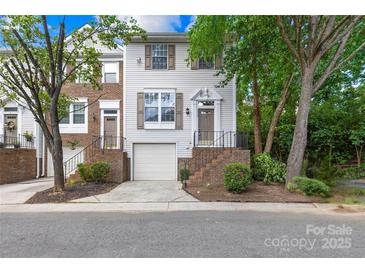 Charming townhome featuring a one car garage, and covered front porch at 9639 Green Gable Ct, Charlotte, NC 28270