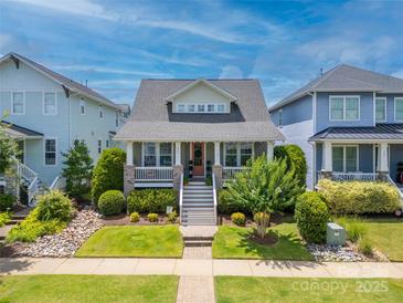 Charming home with a inviting front porch, beautiful lawn, and landscaped garden at 956 Herrons Ferry Rd, Rock Hill, SC 29730