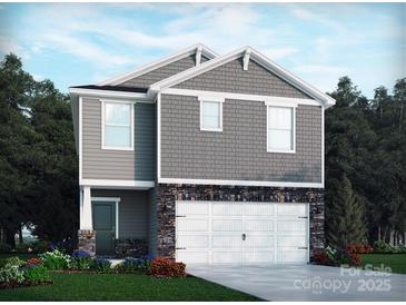 Charming two-story home with stone accents and a well-manicured lawn creates great curb appeal at 1418 31St Ne St, Conover, NC 28613