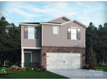 Charming two-story home with brick accents and a two-car garage for modern living at 1434 31St Ne St, Conover, NC 28613