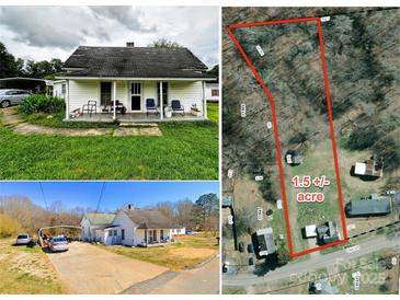 Aerial view of the property showcasing the home, surrounding land, and road access at 211 Oak Dr, Shelby, NC 28150