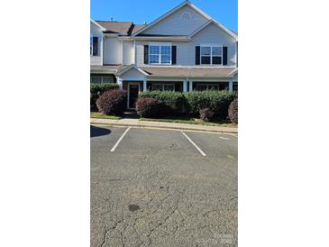 Charming townhouse with well-maintained landscaping and designated parking spaces at 3549 Calpella Ct, Charlotte, NC 28262