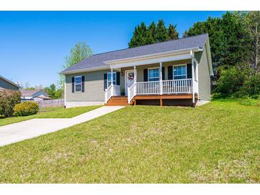 Charming single-story home with a covered front porch and well-manicured lawn at 50 Serenity Ln, Hickory, NC 28601