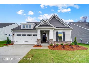 Charming single-story home with a two-car garage, stone accents, and manicured landscaping at 1425 Ardmore Dr # 247, Sherrills Ford, NC 28673
