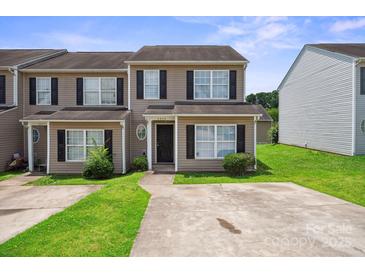 Charming townhouse featuring black shutters and a well-maintained lawn at 5375 Eneida Sue Dr, Charlotte, NC 28214
