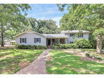 Charming single Gathering home with mature trees, sidewalk and nice front yard at 3311 Camden Rd, Marshville, NC 28103