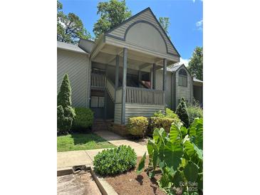 Inviting condo featuring a covered entrance, well-maintained landscaping, and a blend of natural light at 1590 Springpoint Rd # B, Rock Hill, SC 29732