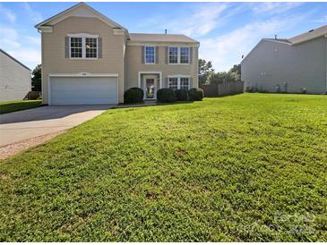 Charming two-story home with well-maintained lawn and attached garage, perfect for a Gathering at 1958 Leesburg Dr, Clover, SC 29710