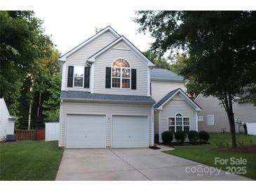 Charming two-story home featuring a two-car garage and well-maintained lawn at 3092 S Legacy Park Blvd, Fort Mill, SC 29707