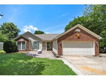 Charming single-story home with a brick facade and a well-manicured front lawn at 4507 Mackinac St, Charlotte, NC 28269