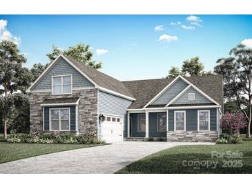 Charming home with stone and siding, a well-manicured lawn, and an attached garage under a blue sky at 2085 Fordhill St, Rock Hill, SC 29732